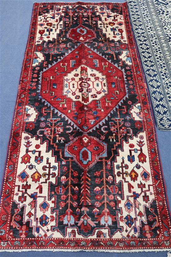 A Hamadan rug, 283cm x 120cm